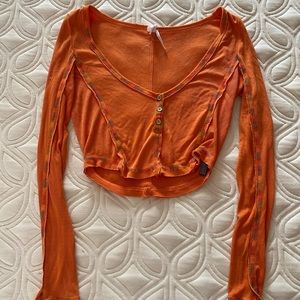 Super cute brand new urban outfitters orange top with rainbow stitching